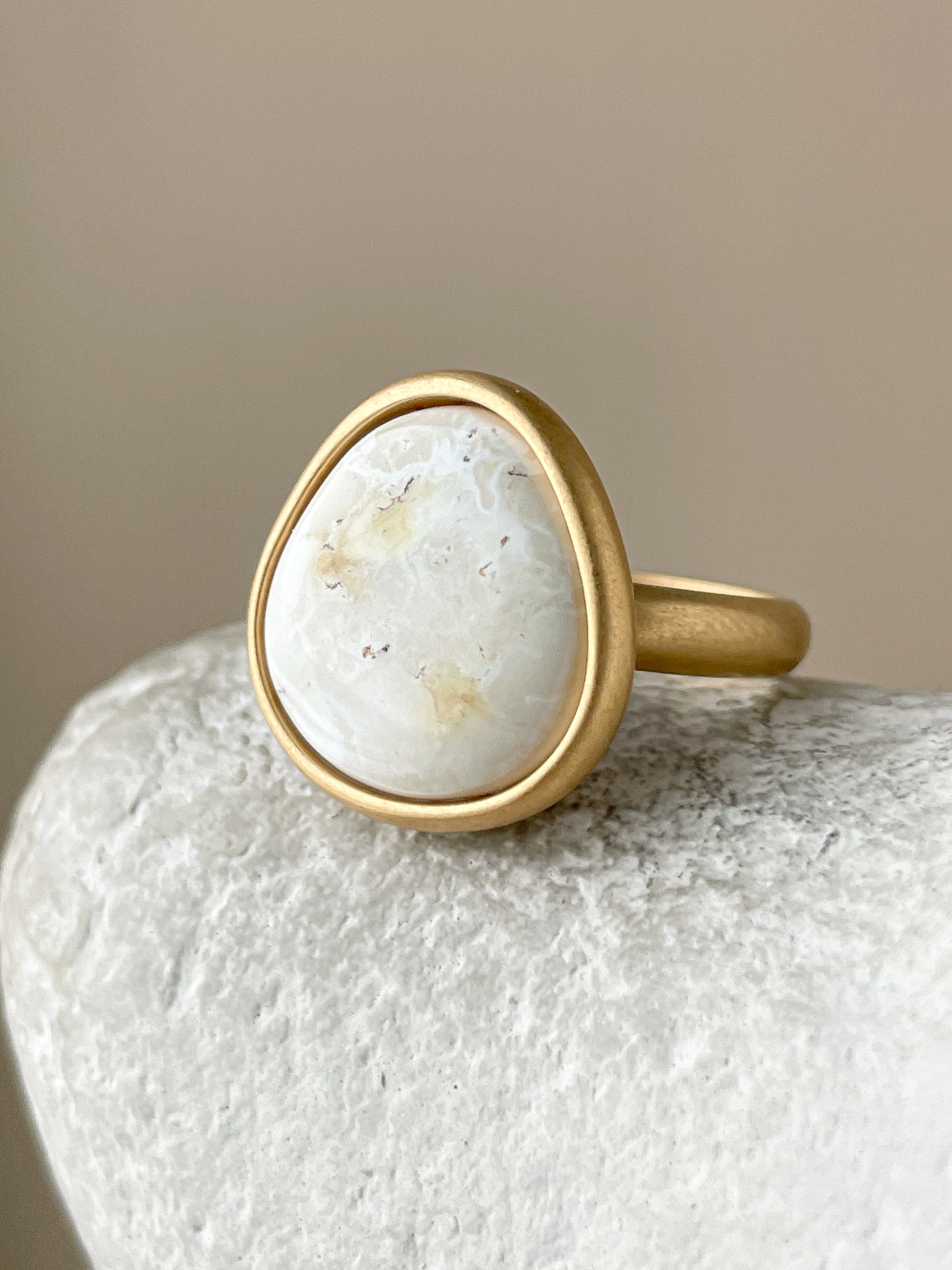 Large gold-plated ring with white amber, size 7 1/2