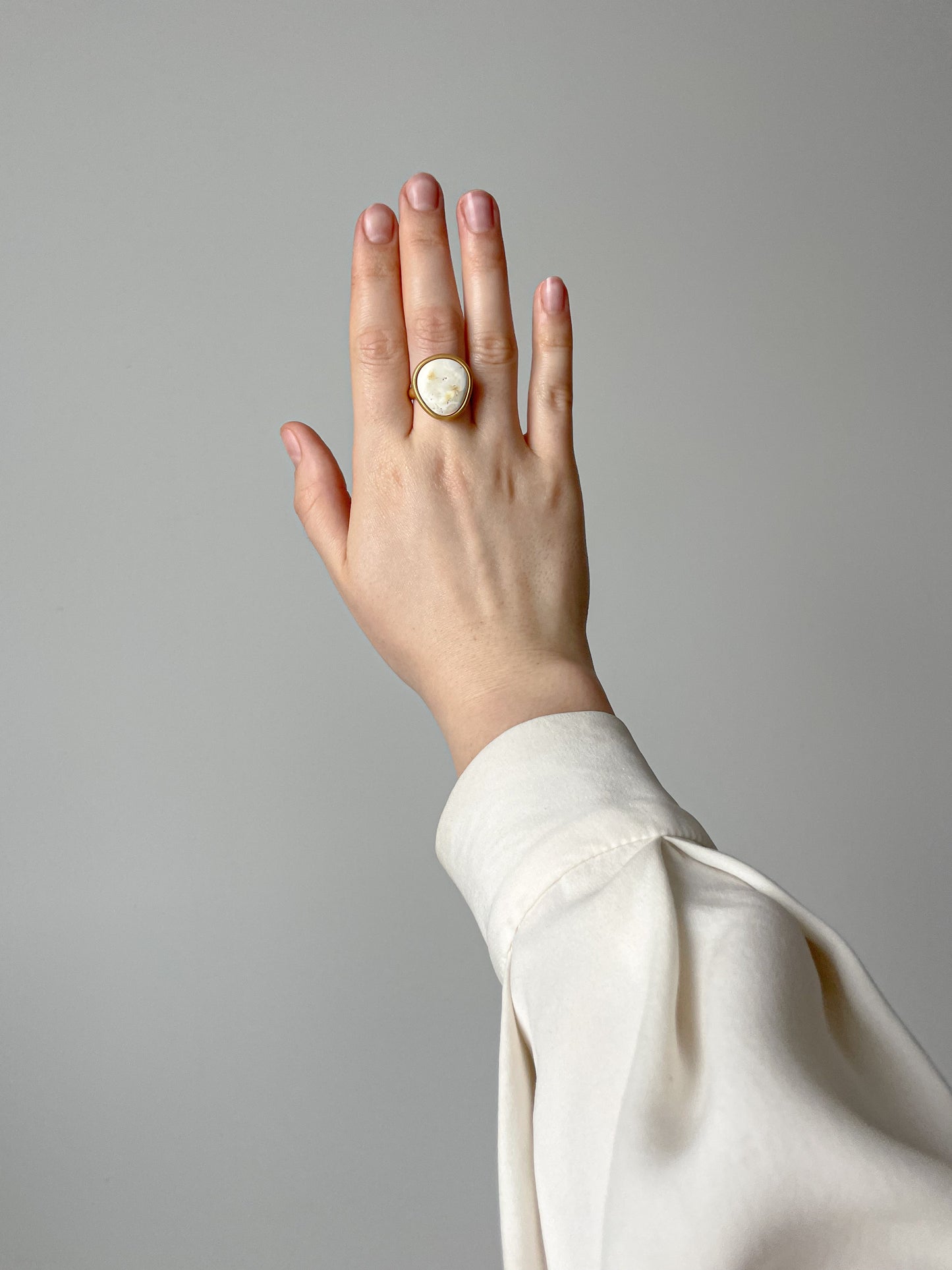 Large gold-plated ring with white amber, size 7 1/2