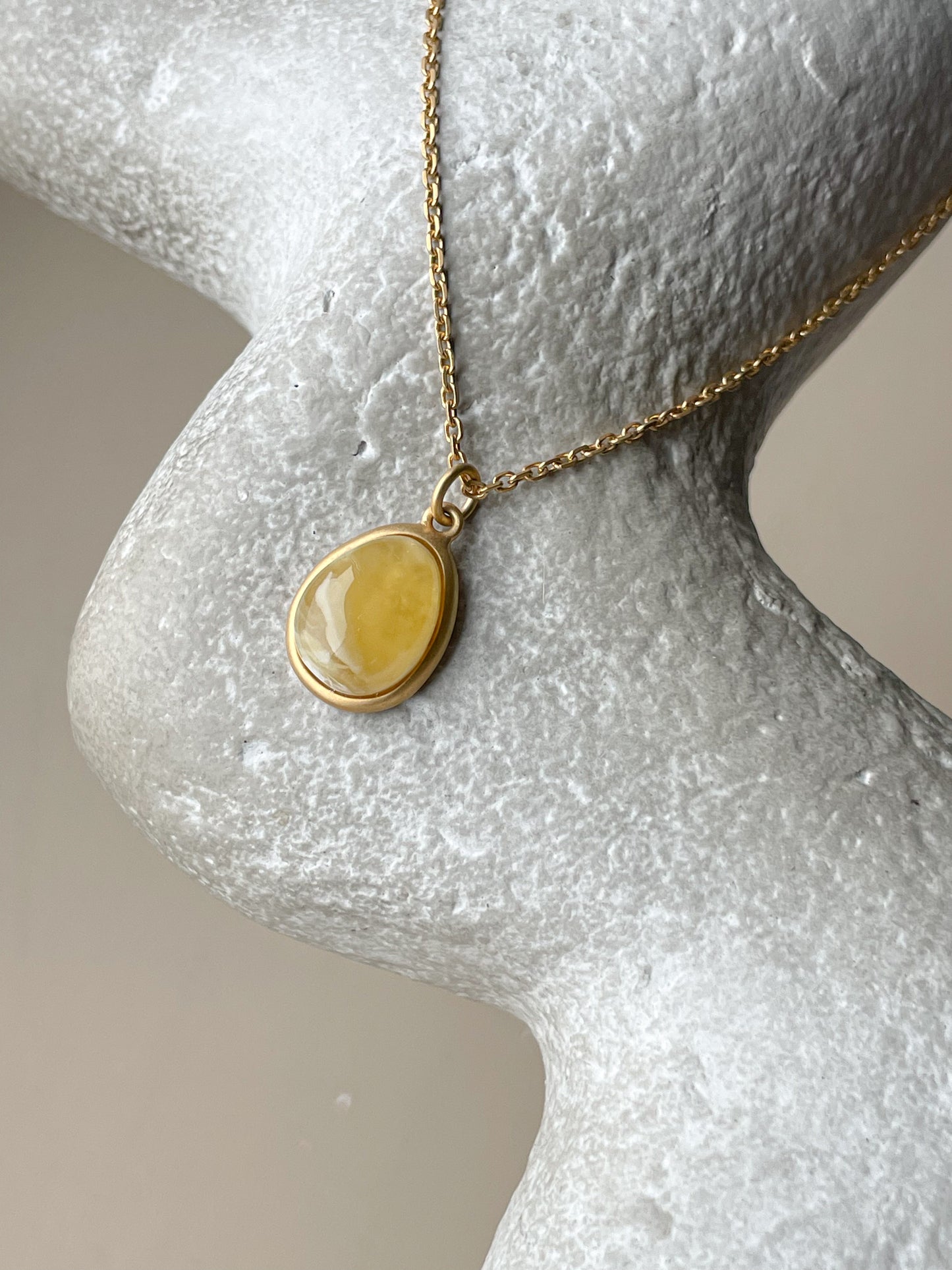 Gold plated pendant with butterscotch amber