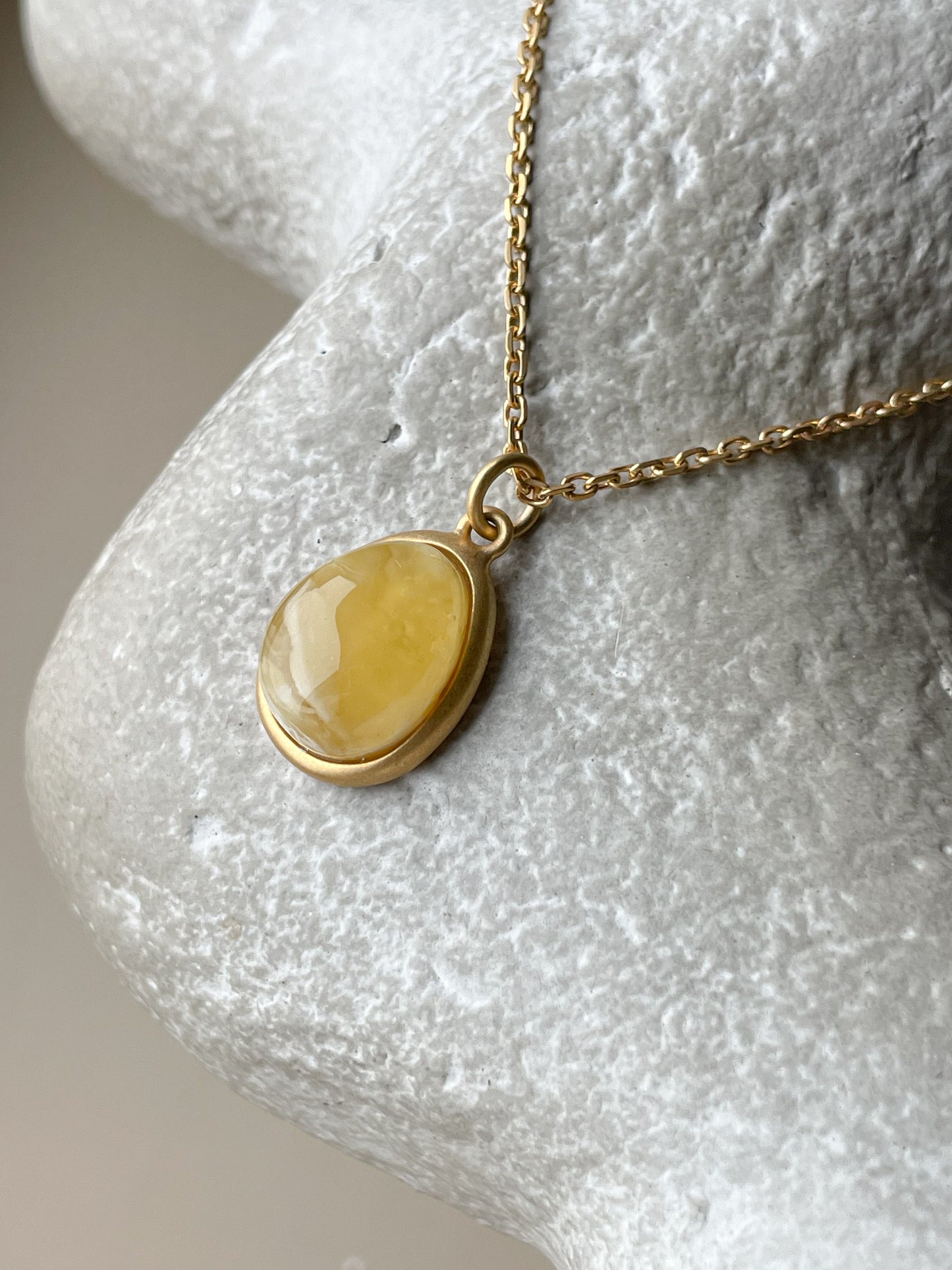 Gold plated pendant with butterscotch amber