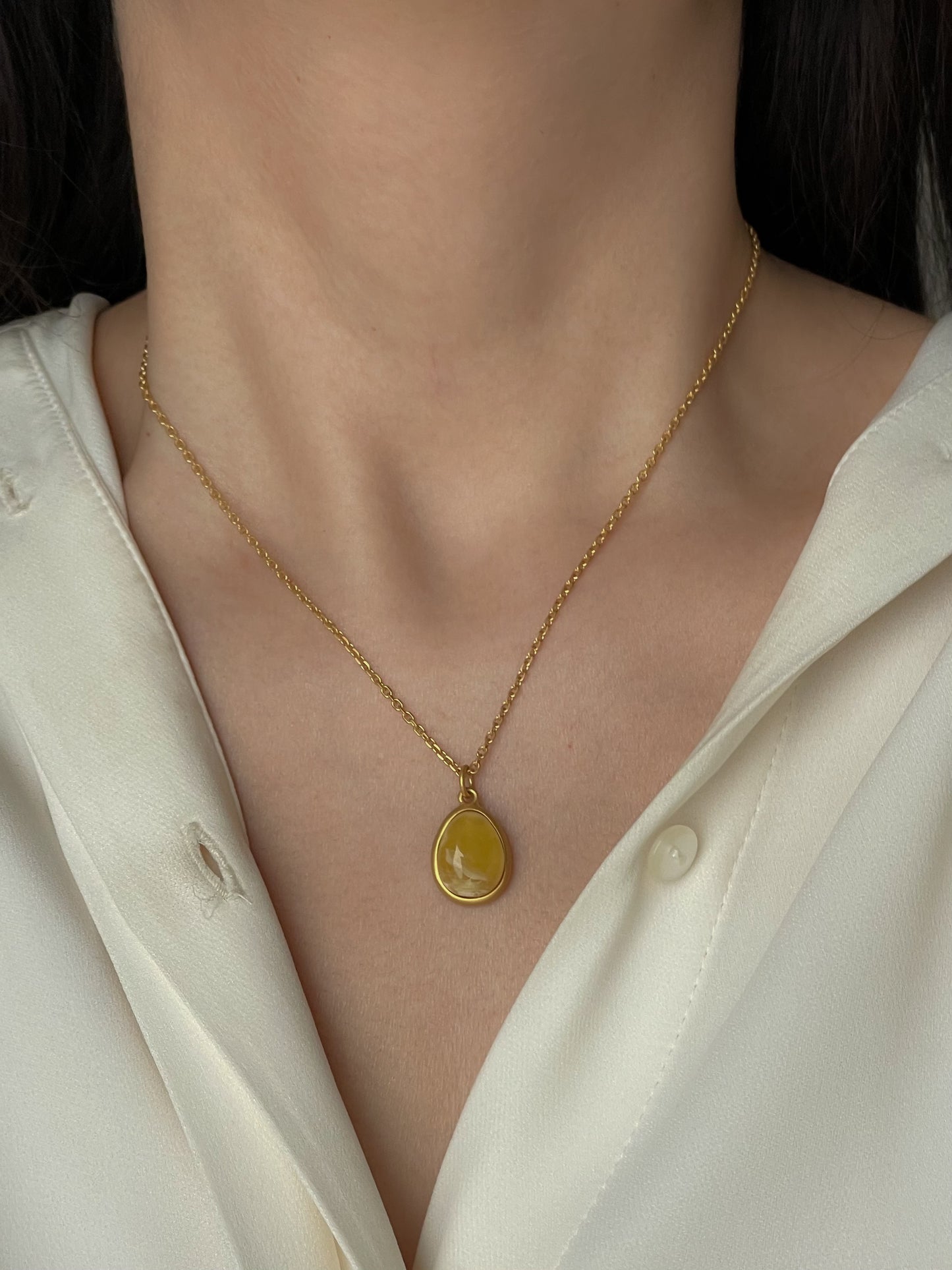 Gold plated pendant with butterscotch amber