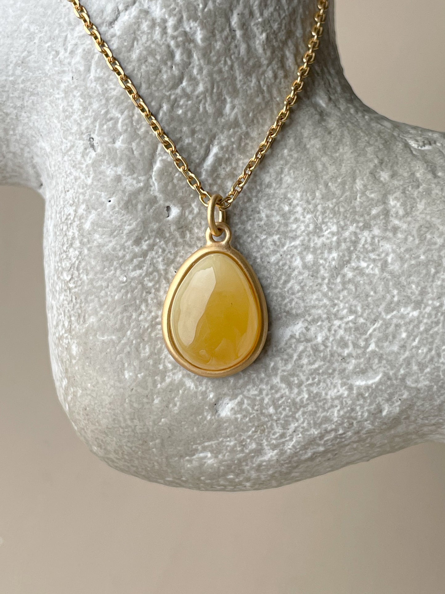 Gold plated pendant with butterscotch amber