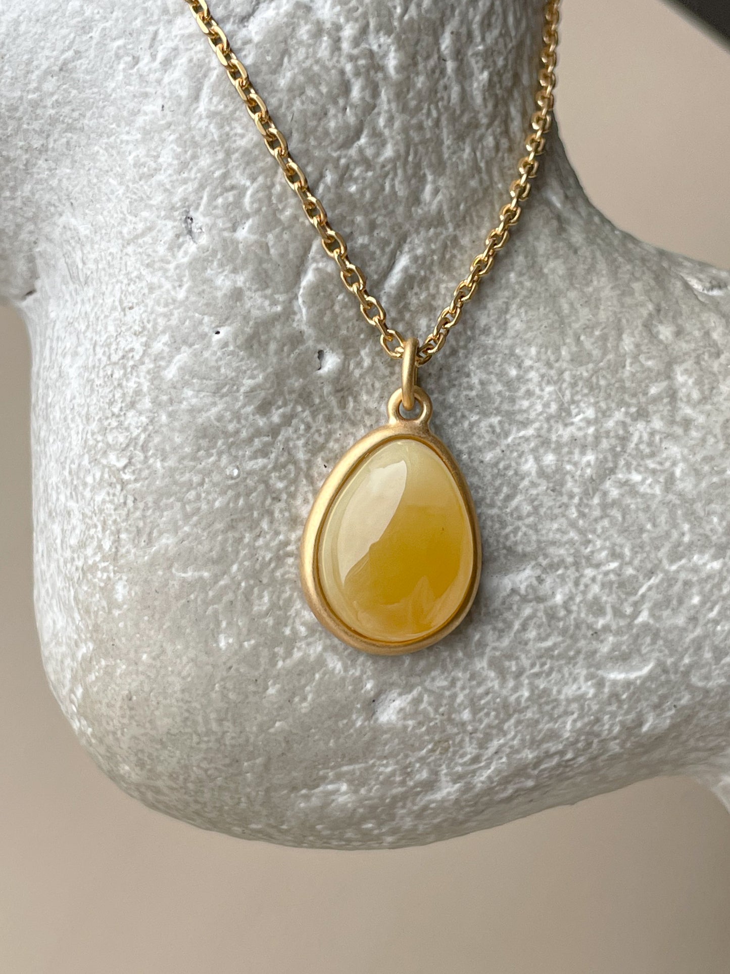 Gold plated pendant with butterscotch amber