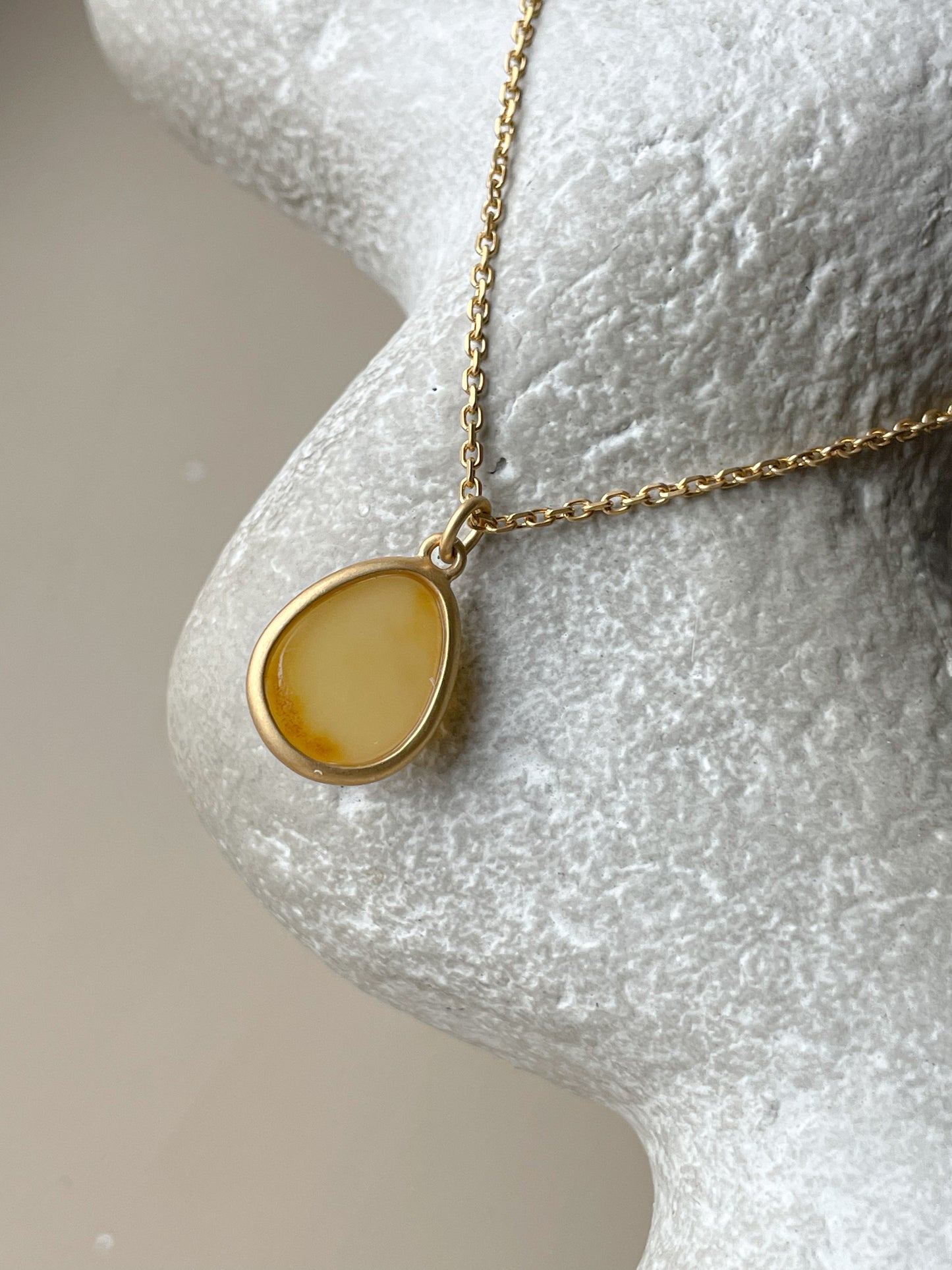 Gold plated pendant with butterscotch amber