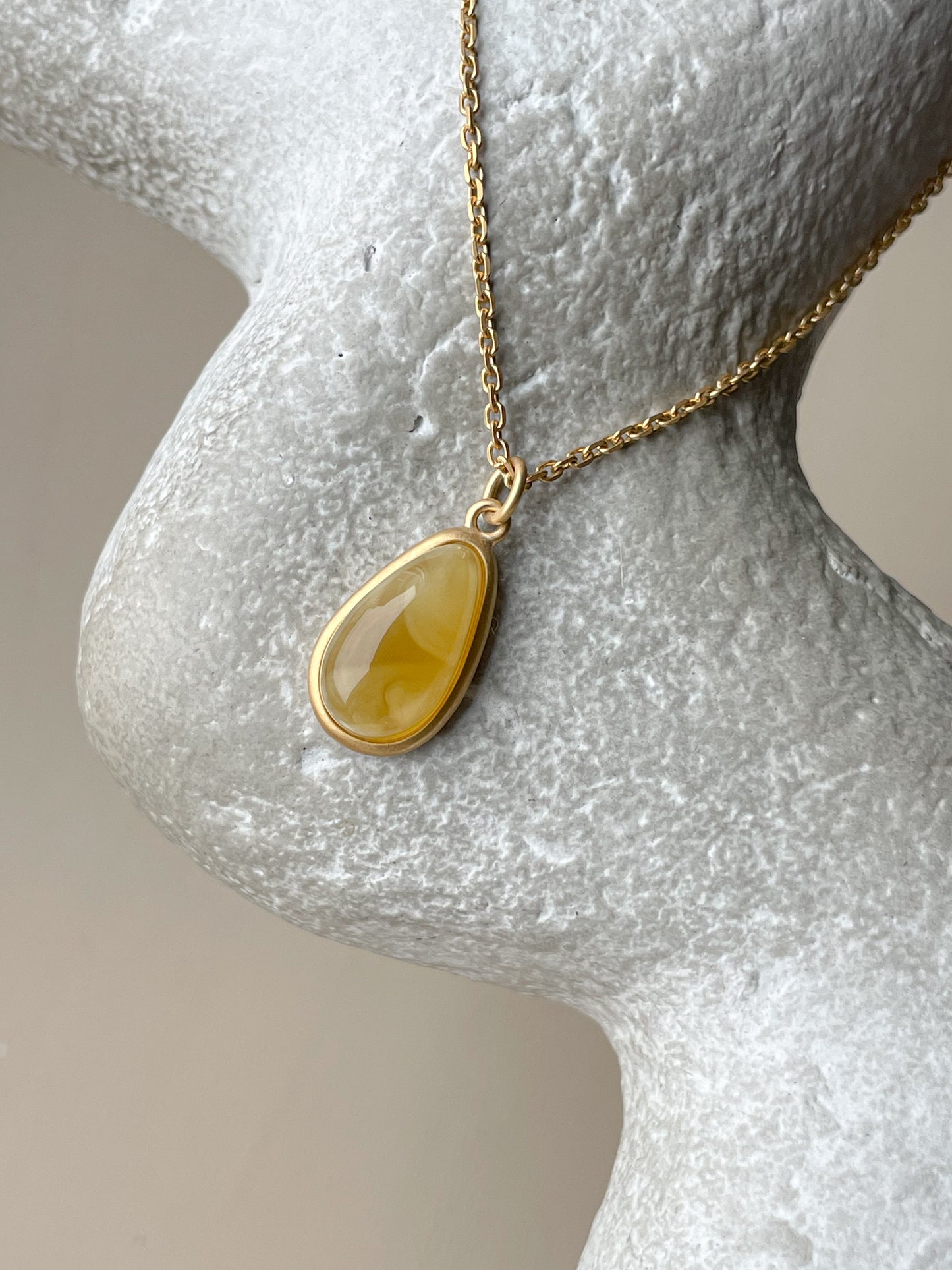 Gold plated pendant with butterscotch amber