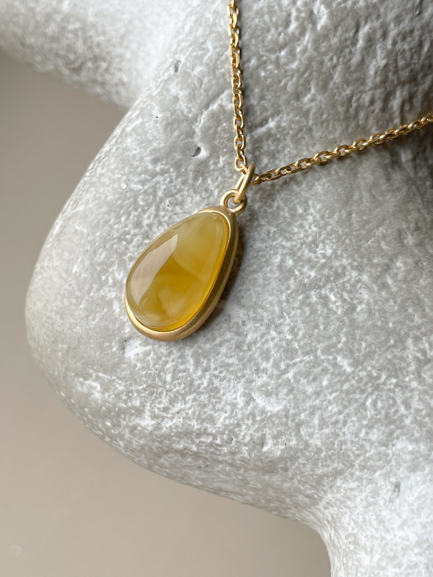 Gold plated pendant with butterscotch amber