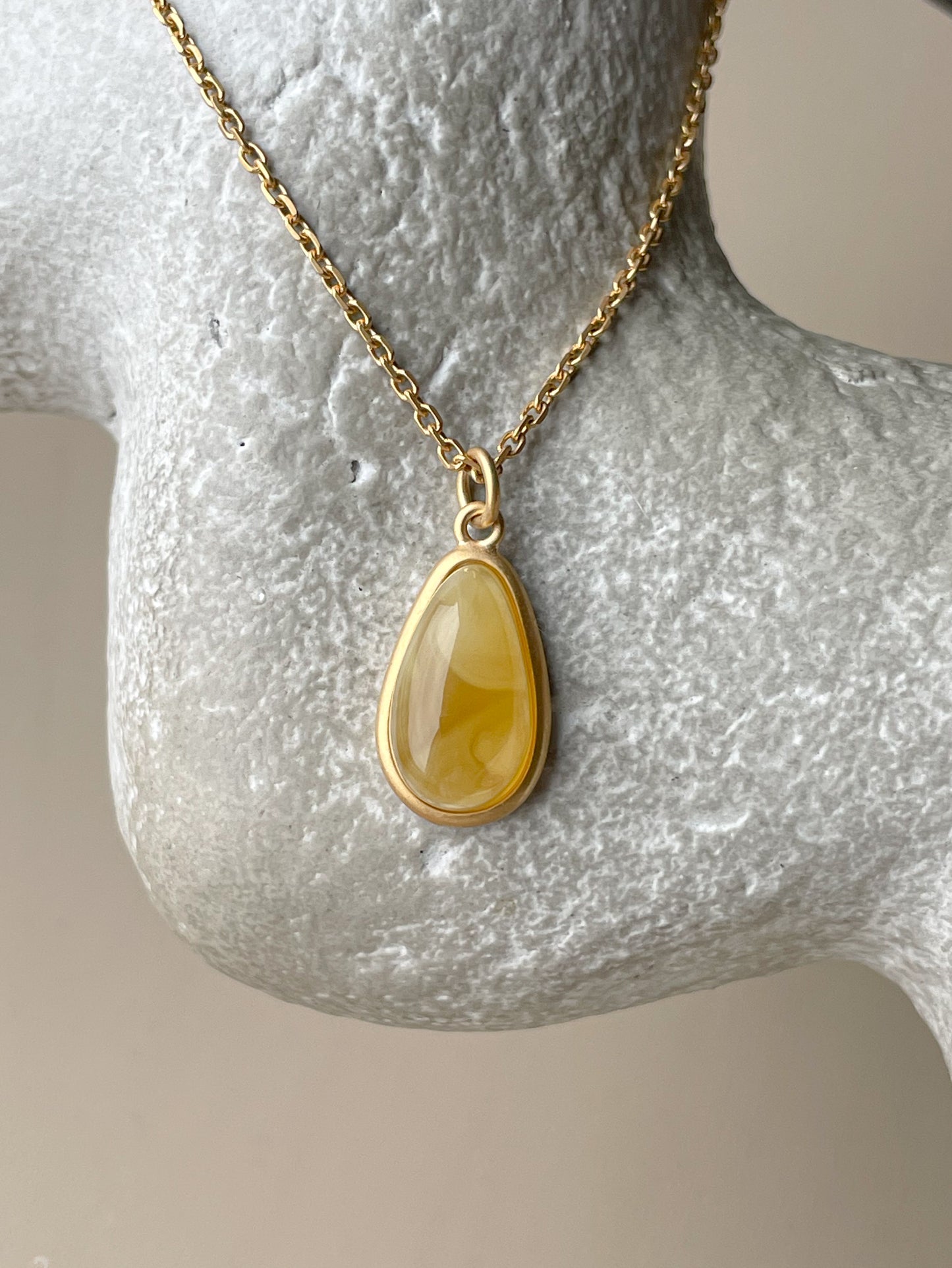 Gold plated pendant with butterscotch amber