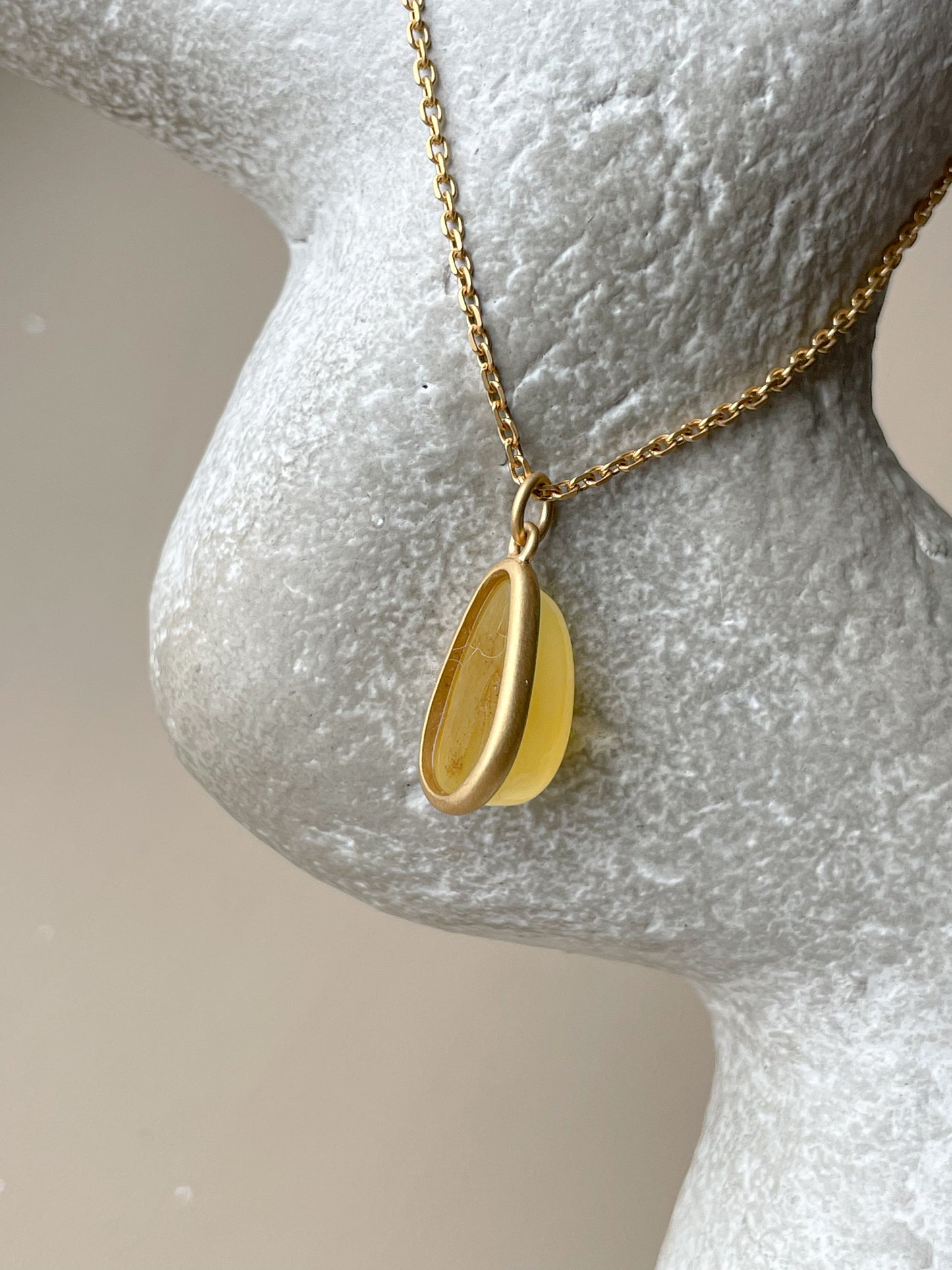 Gold plated pendant with butterscotch amber