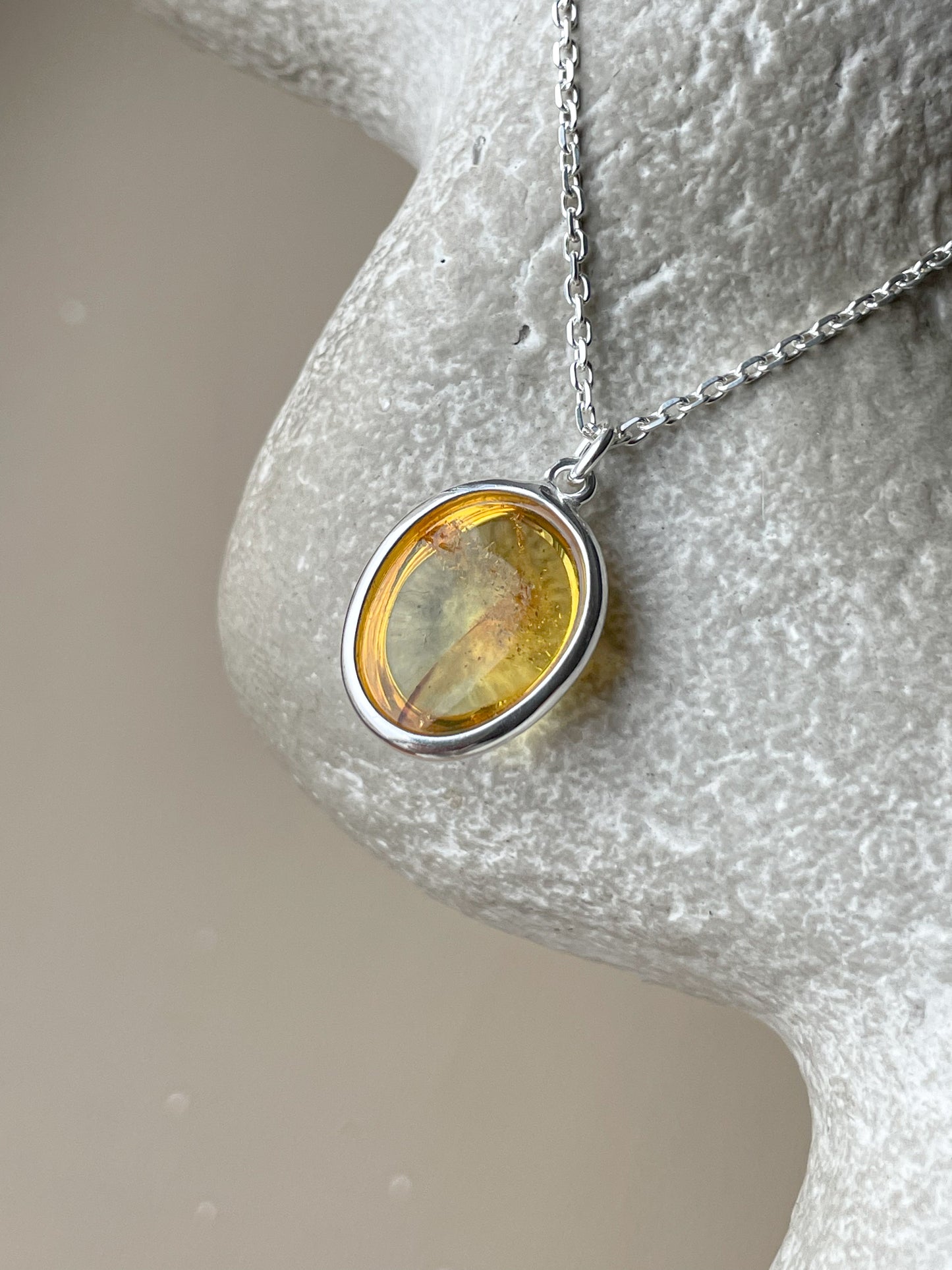 Sterling silver pendant with honey amber