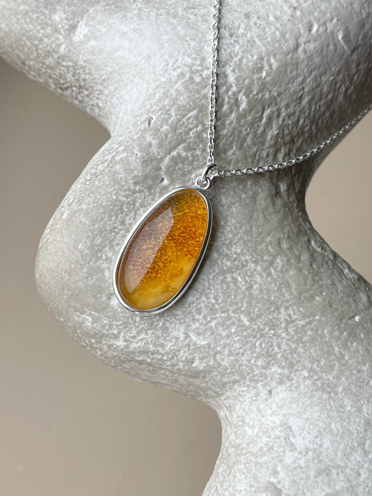 Sterling silver pendant with honey amber