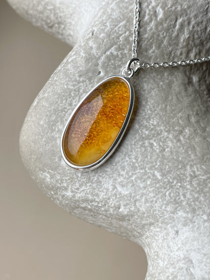 Sterling silver pendant with honey amber