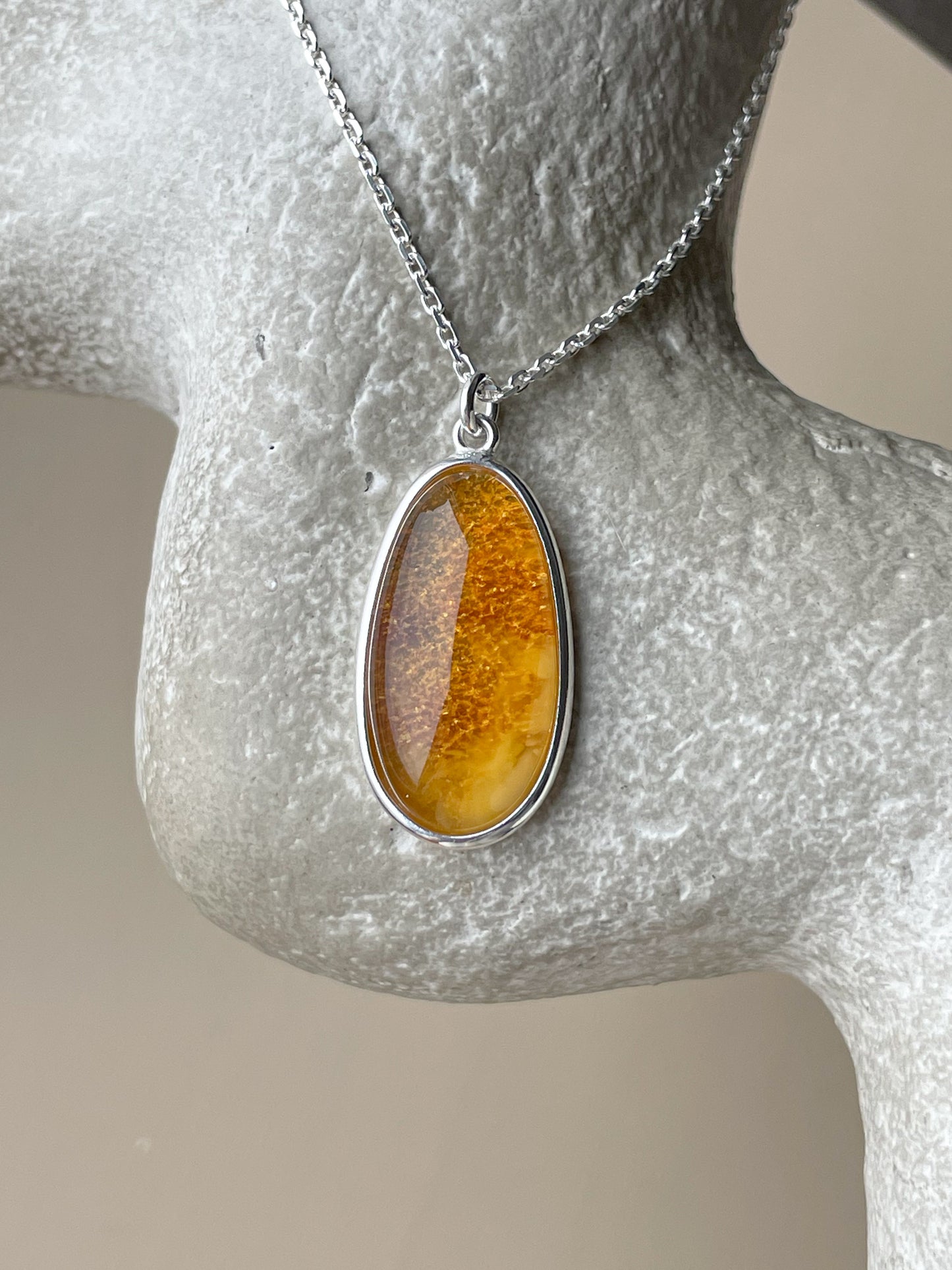 Sterling silver pendant with honey amber