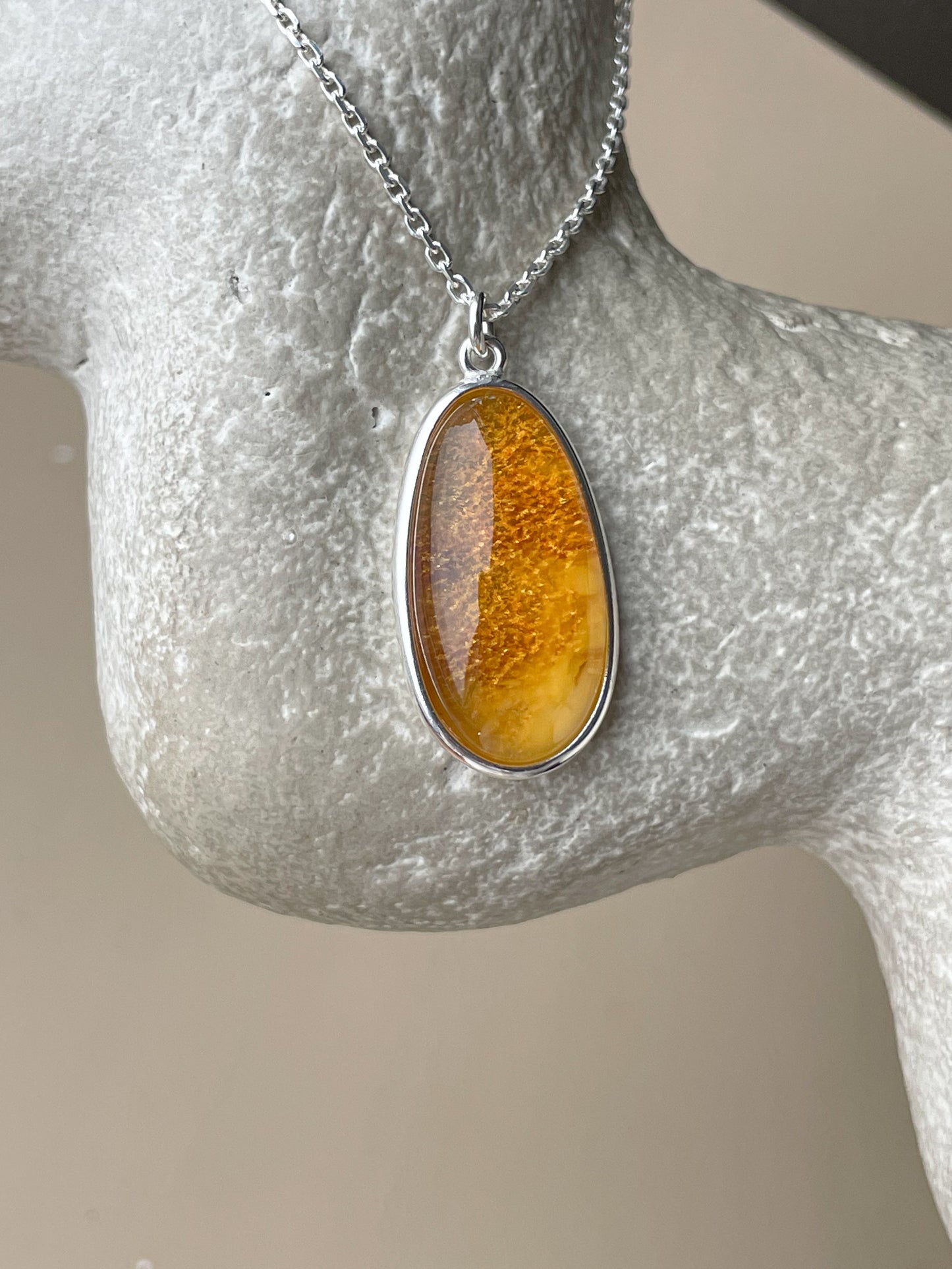 Sterling silver pendant with honey amber