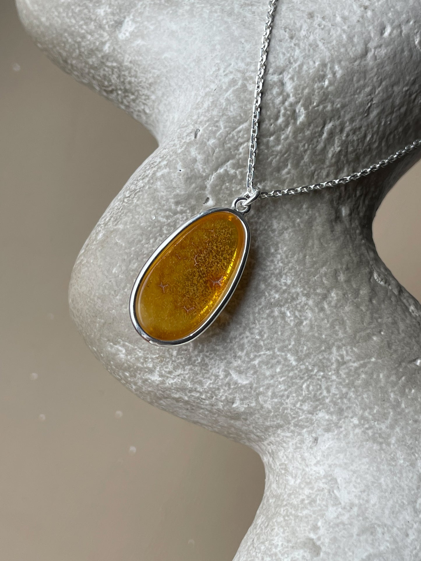 Sterling silver pendant with honey amber