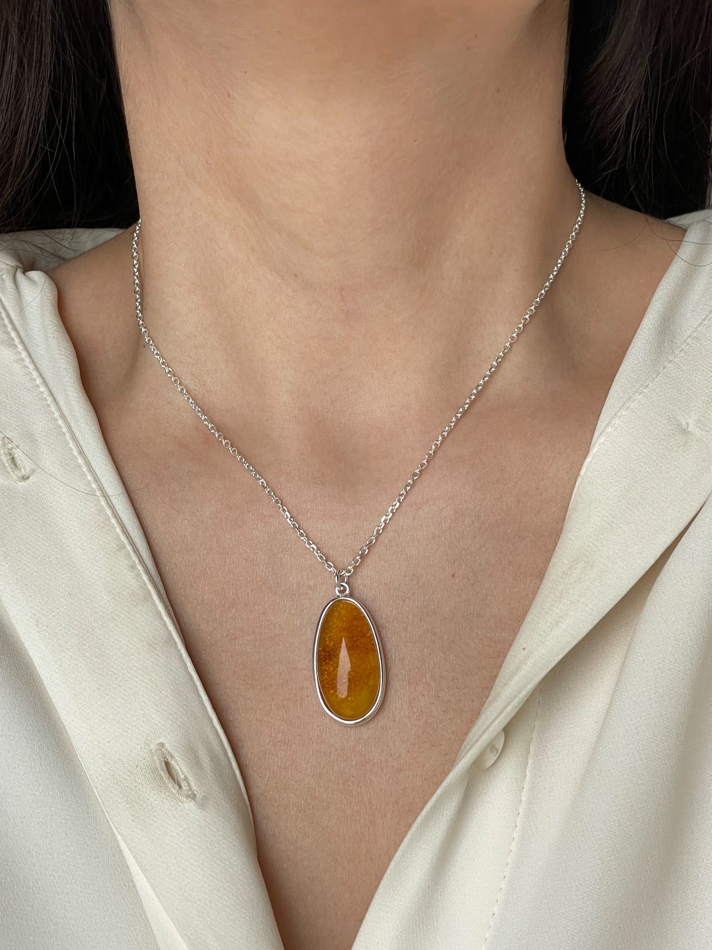 Sterling silver pendant with honey amber