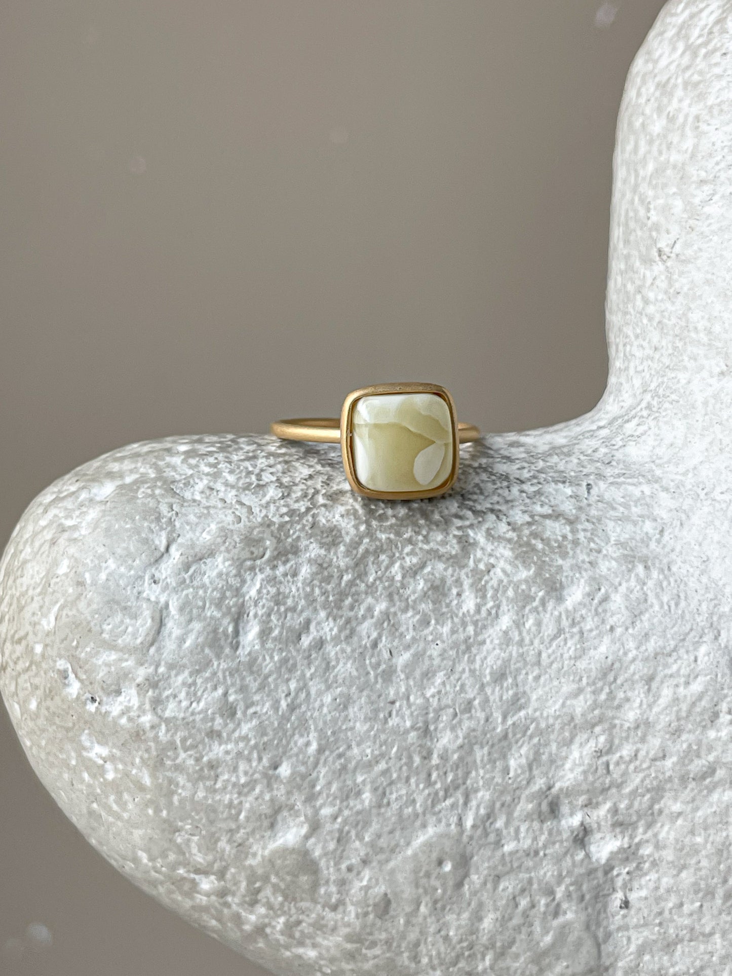 Gold plated silver ring with milky amber, size 6