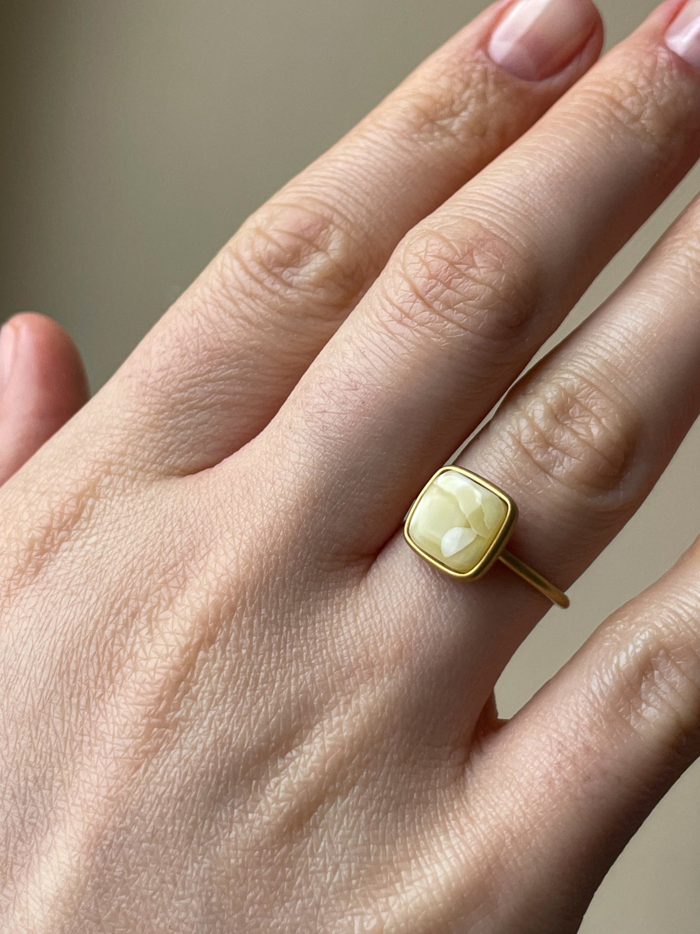 Gold plated silver ring with milky amber, size 6