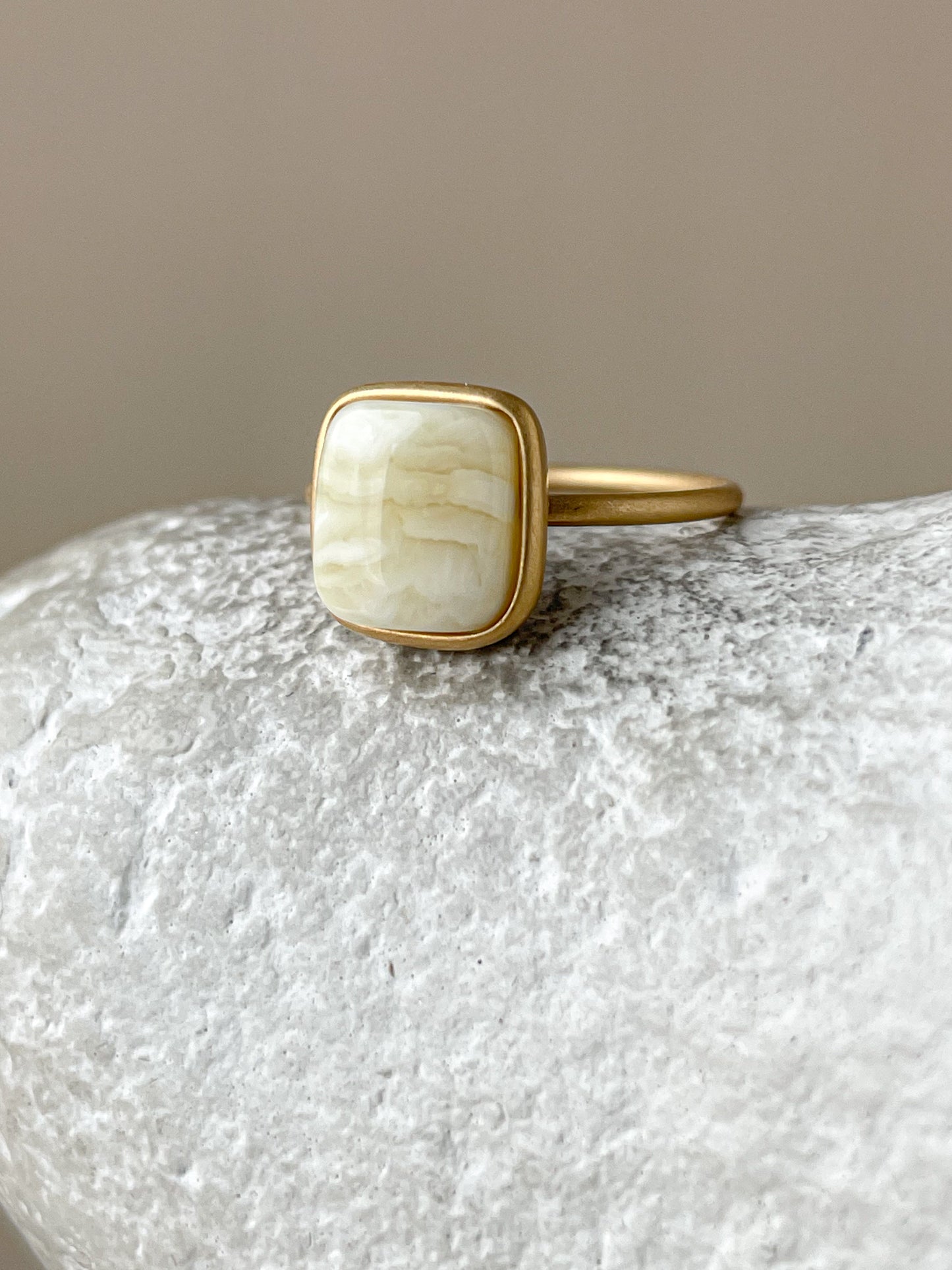 Gold plated silver ring with milky amber, size 6 3/4