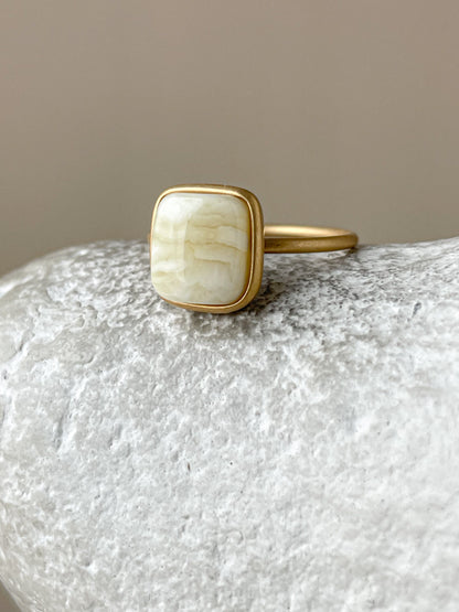 Gold plated silver ring with milky amber, size 6 3/4