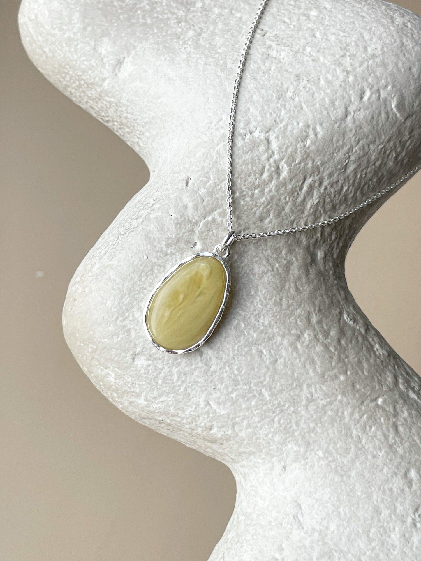 Sterling silver pendant with matte amber