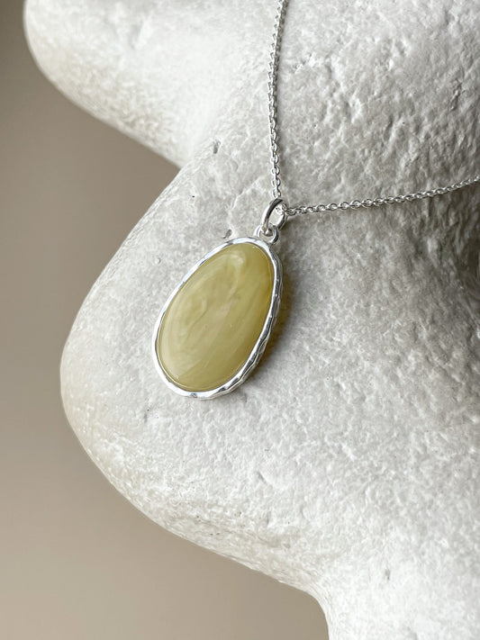 Sterling silver pendant with matte amber