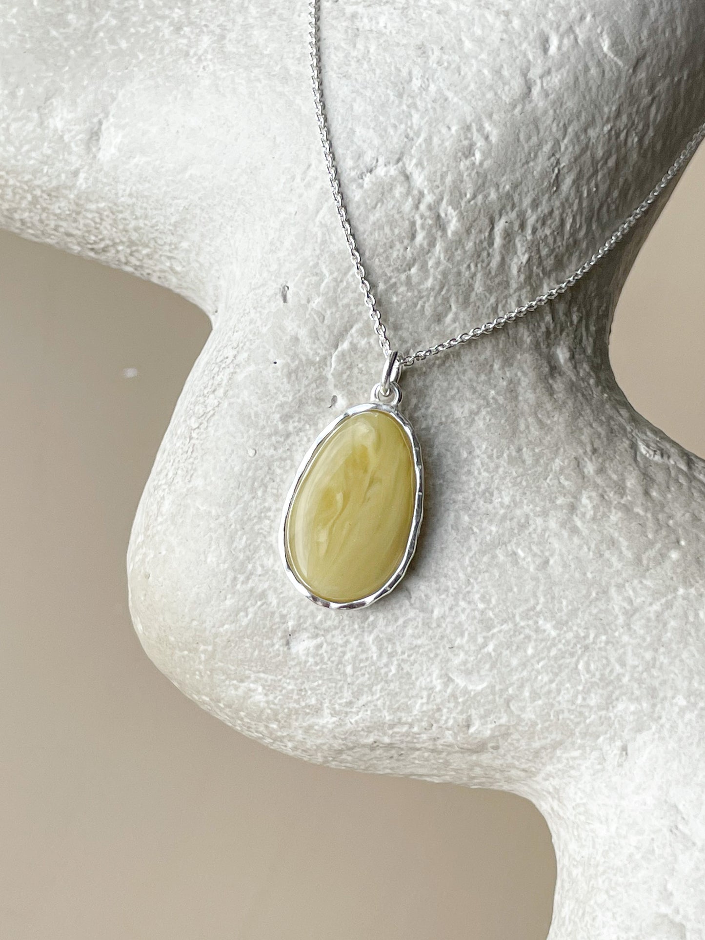 Sterling silver pendant with matte amber