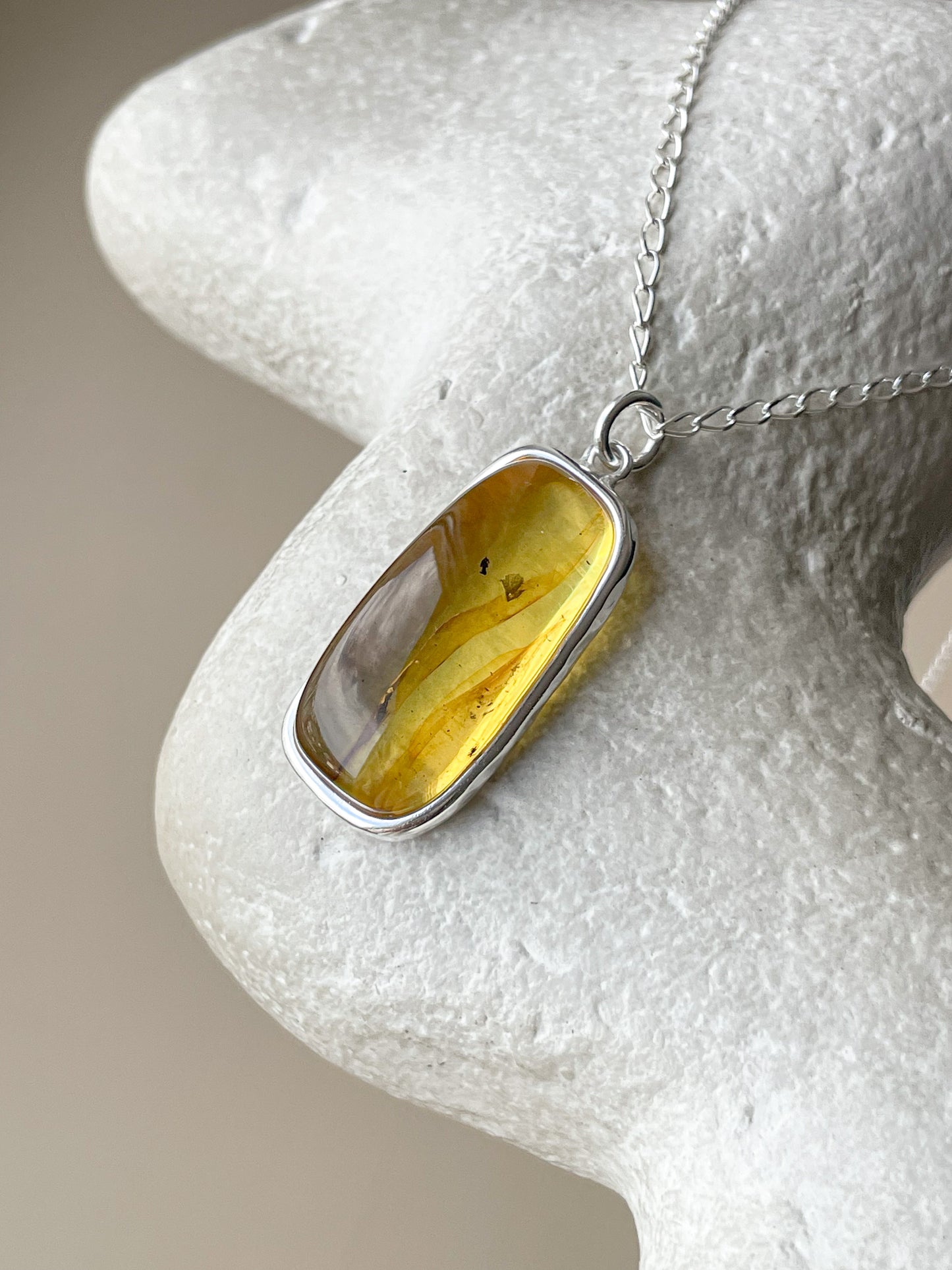 Large sterling silver pendant with honey amber stone