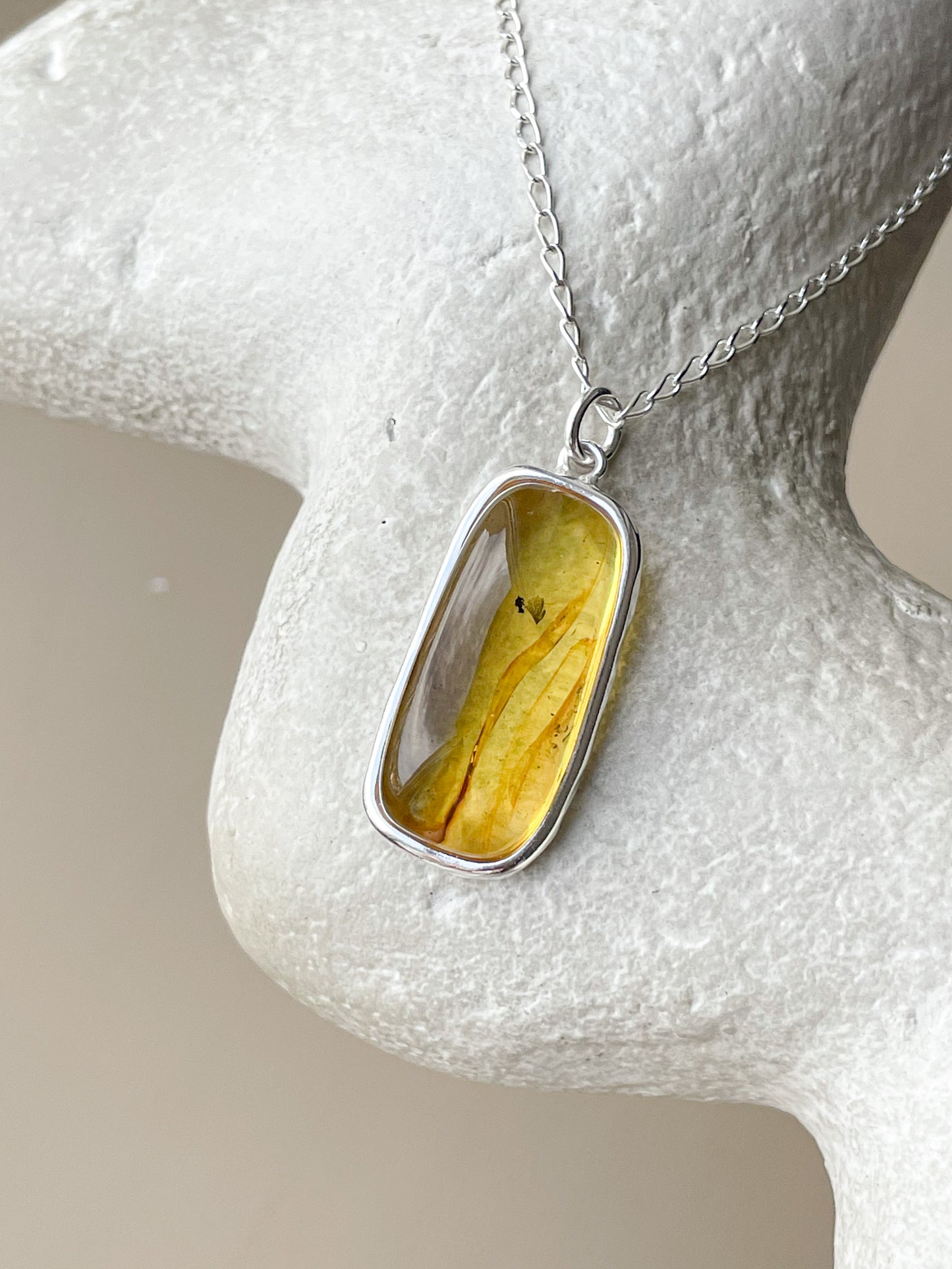 Large sterling silver pendant with honey amber stone