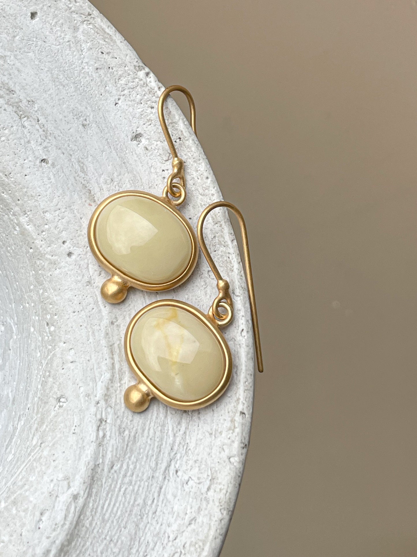 Gold plated wire hook earrings with milky amber