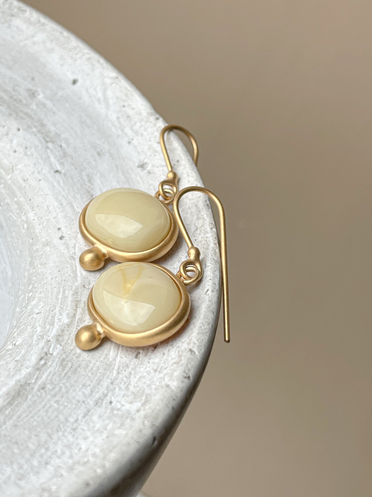 Gold plated wire hook earrings with milky amber