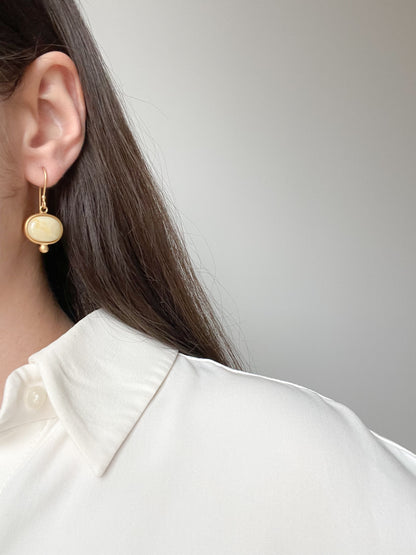 Gold plated wire hook earrings with milky amber